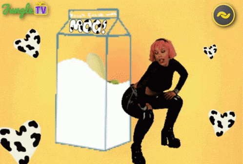a woman is dancing in front of a carton of milk that says moo