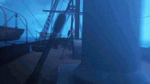 a boat is floating in the water with a blue sky in the background