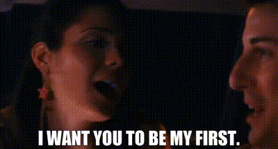 a man and a woman are talking to each other in a dark room .