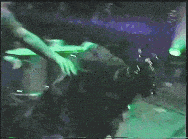 a blurry picture of a person in a dark room