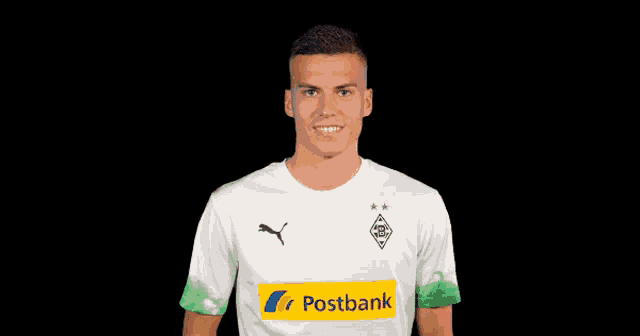 a soccer player is giving a thumbs up and wearing a shirt that says westbank