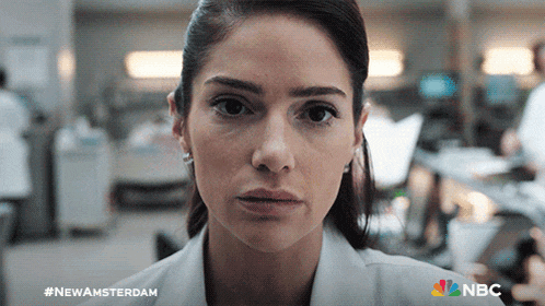 a close up of a woman 's face with a nbc logo in the corner
