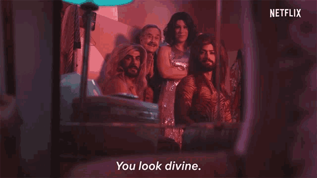 a netflix ad shows a group of drag queens and says " you look divine "