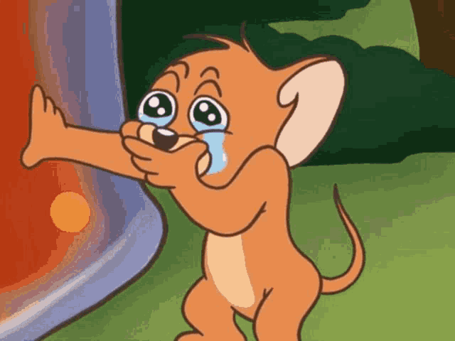 jerry from tom and jerry is crying while holding a stick