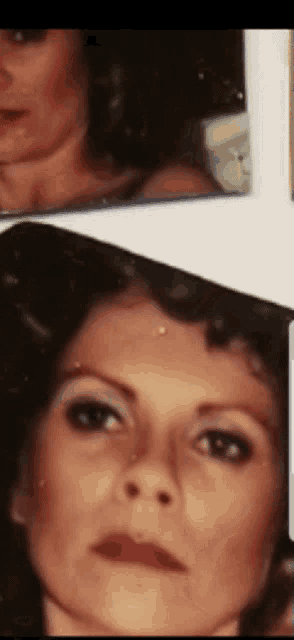 a close up of a woman 's face with a serious look on her face
