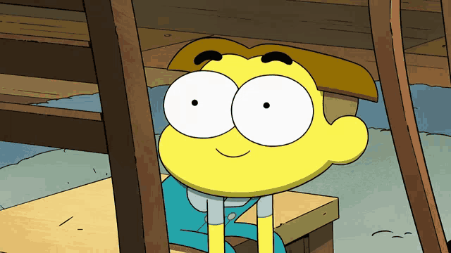 a cartoon character with big eyes is sitting on a wooden table