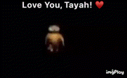 a blurry picture of a cartoon character with the words `` love you , tayah '' written on it .
