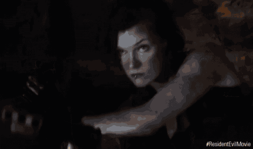a close up of a woman 's face with a light coming out of her hair .