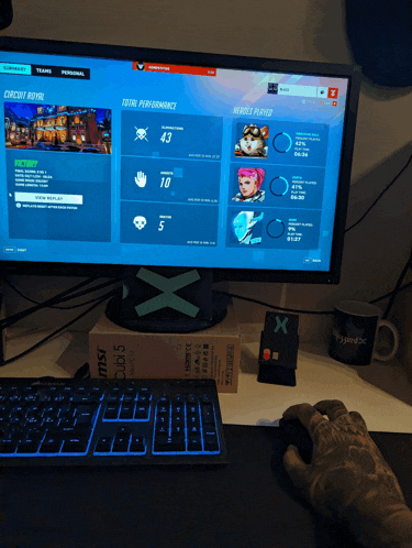 a person is playing a video game on a msi computer