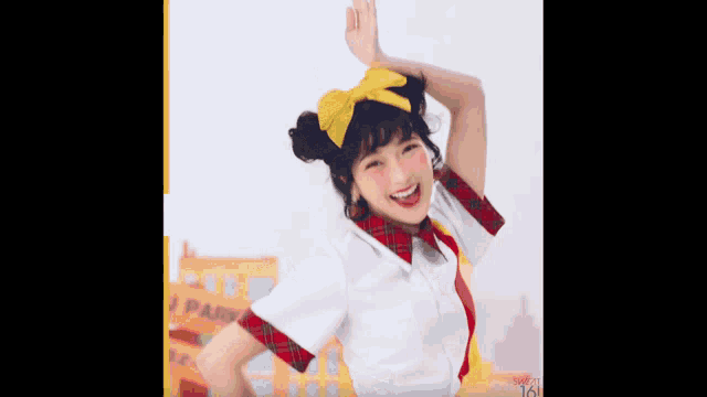 a girl in a clown costume is pointing at herself and smiling