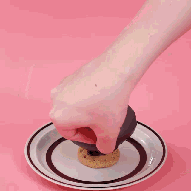 a person is making a chocolate bowl with oreos on a plate