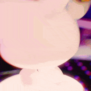 a blurred image of a white cat with a purple background