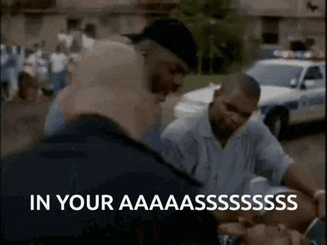 a group of men are standing in front of a police car with the words in your aaaaasssss written on the screen