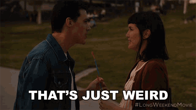 a man and a woman are looking at each other with the words that 's just weird above them
