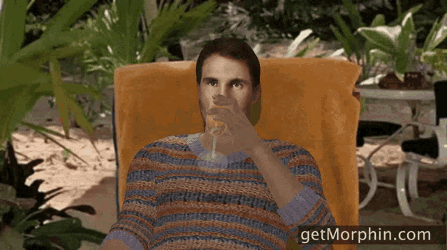 a man is sitting in a chair drinking orange juice and the website getmorphin.com is visible in the corner