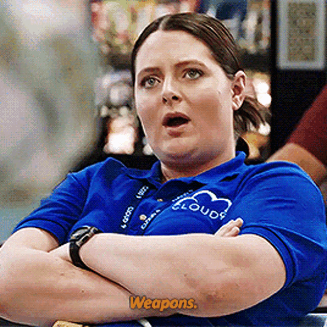 a woman wearing a blue shirt that says cloud 9 on it