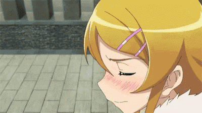 a girl with blonde hair and a pink ribbon in her hair is blushing