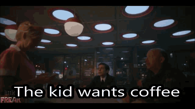 the kid wants coffee is written on a screen
