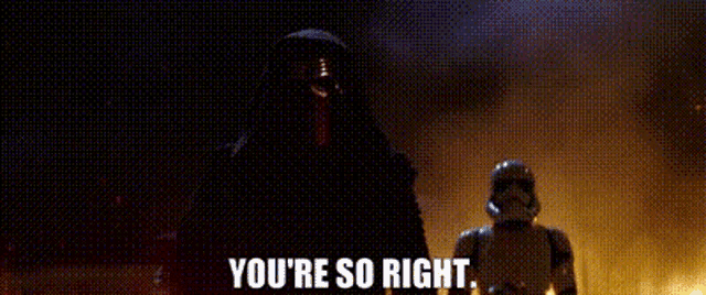 kylo ren and stormtrooper are standing next to each other in the dark .