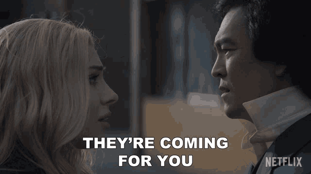 a man and woman are looking at each other with the words they 're coming for you