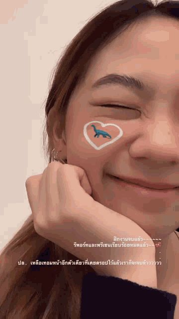 a woman with a heart drawn on her face
