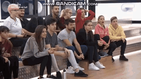a group of people are sitting in a room with the words www.bandicam.com on the bottom of the screen
