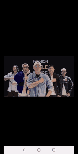 a group of men are dancing in front of a sign that says fas on sale