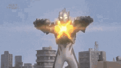 a blurred image of a city with a large explosion in the background .