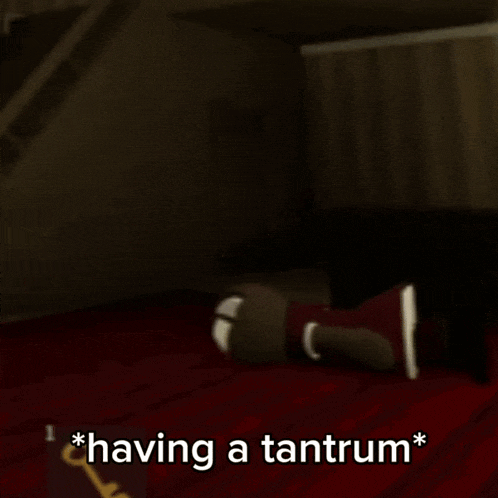 a cartoon character is laying on a bed with the words " having a tantrum " below it