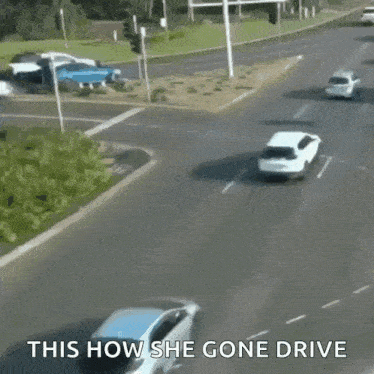 a white car is driving down a street with the words " this how she gone drive " written on the bottom