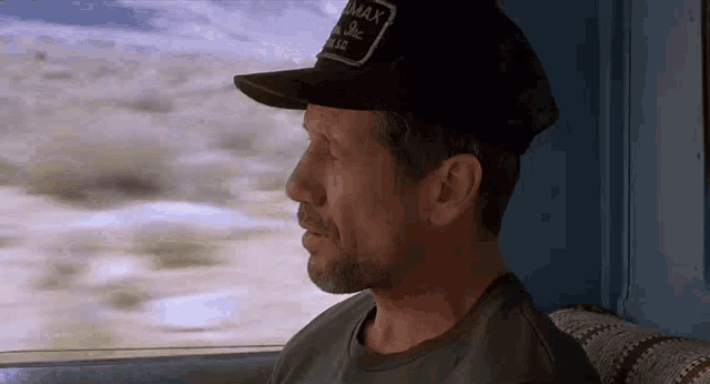 a man wearing a hat that says ' max ' on it