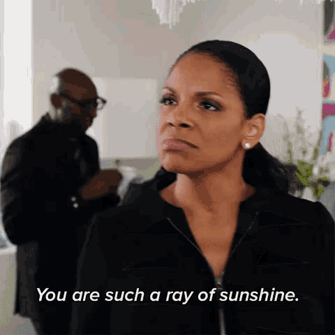 a woman in a black jacket says you are such a ray of sunshine