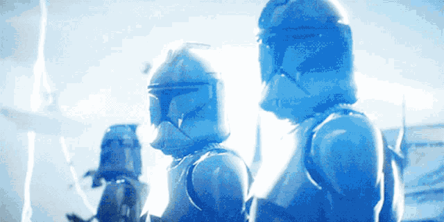 a group of clone troopers are standing next to each other in a blue light