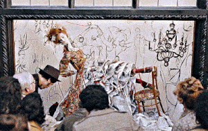 a group of people looking at a drawing of a woman in a dress