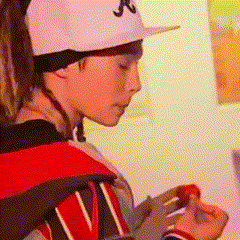 a person wearing a white hat with the letter j on it