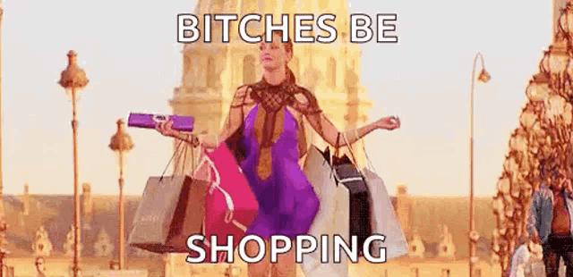 a woman is holding a lot of shopping bags and a purse .