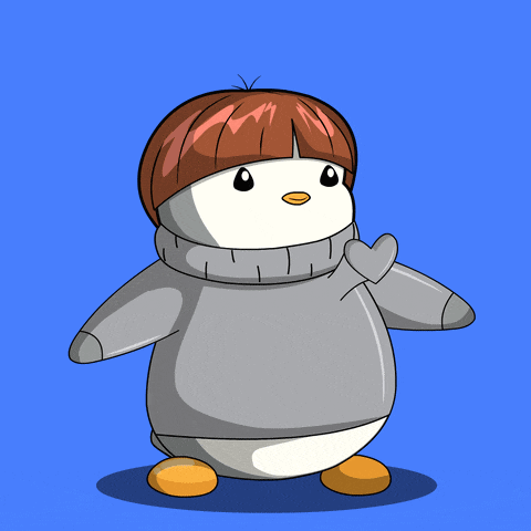a penguin is wearing a sweater and holding a heart in its hand