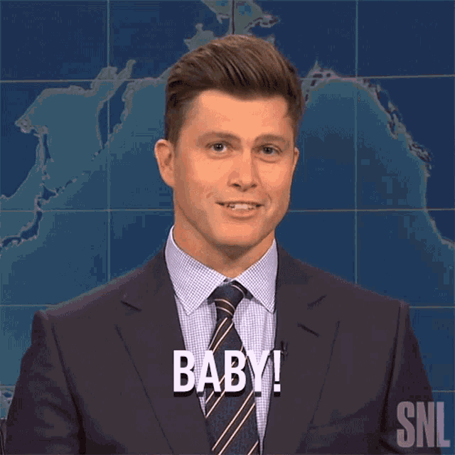 a man in a suit and tie says " baby "