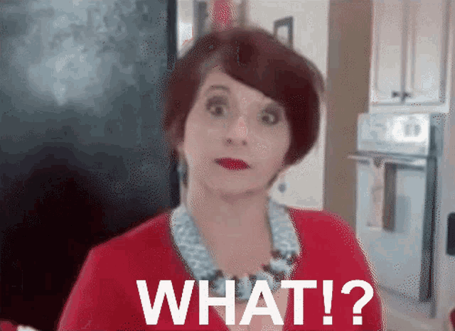 a woman in a red shirt says what