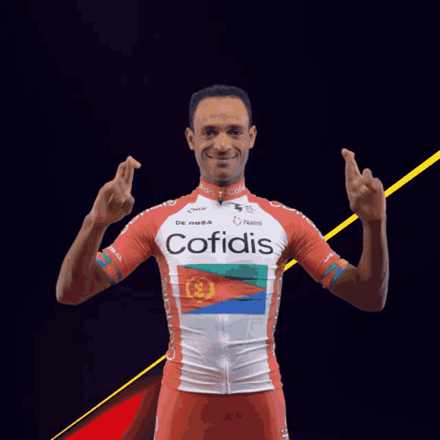 a man wearing a red and white cofidis shirt