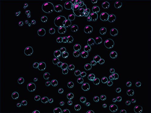 a bunch of soap bubbles are floating in the air on a black background