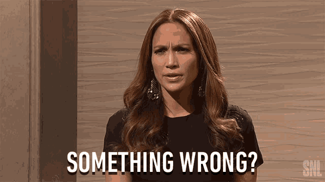 a woman says something wrong in front of a snl logo