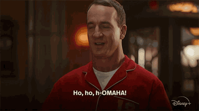 a man in a red pajama shirt is saying ho ho h-omaha