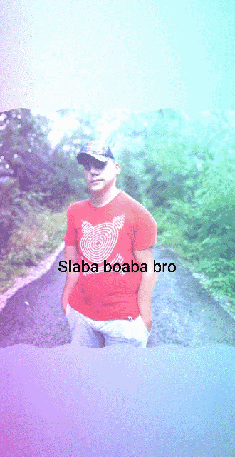 a man in a red shirt stands on a road with the words slaba boaba bro below him