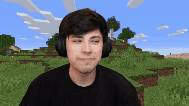 a man wearing headphones looks at the camera in front of a minecraft scene