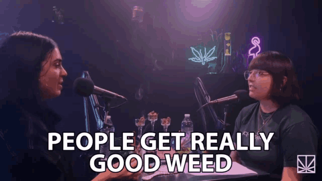 two women are sitting at a table with microphones and the words people get really good weed