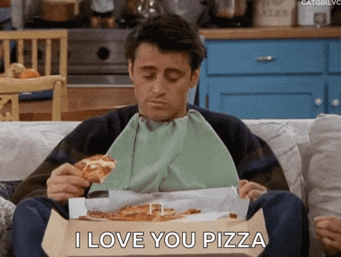 a man is sitting on a couch eating pizza and saying i love you pizza