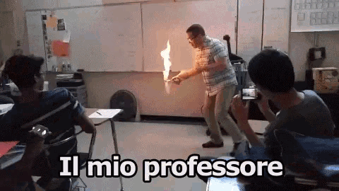 a man in a plaid shirt is holding a piece of paper with flames coming out of it and the words il mio professore above him