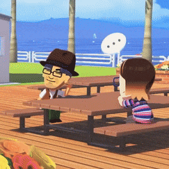 a man in a hat sits at a table with a girl