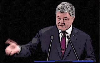 a man in a suit and tie is giving a speech in front of two microphones with the words закуси written above him